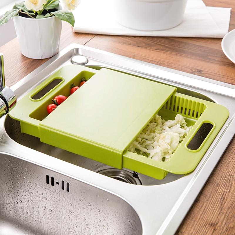 chopping board on the zinc [sink] with vegetables in the container Kitchenile - Green